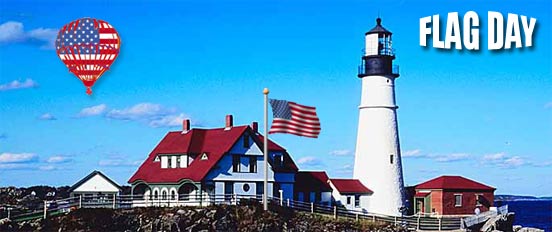 American Flags flying over lighthouse