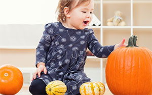 child with pumpkins